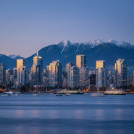 Vancouver Wall Art canvas print, the glass towers of the downtown peninsula at dusk with snow-capped coast mountains behind