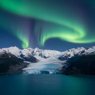 Alaska Wall Art canvas print, a glacier spilling between immense snow peaks into a fjord with green northern lights above