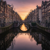 Amsterdam Wall Art canvas print, narrow gabled canal houses and an arched bridge with moored bicycles