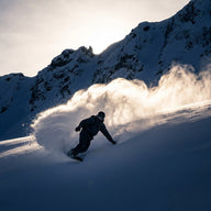 Snowboarding Wall Art canvas print, a snowboarder carving a deep powder turn