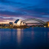 Sydney Wall Art canvas print, the shell-vaulted opera house and the steel arch bridge across the harbor at blue hour