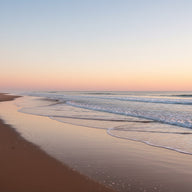 Beach Wall Art canvas print, a wide empty beach at low tide, wet sand mirroring a pastel sky