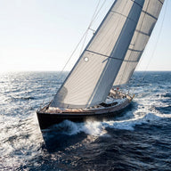 Sailing Wall Art canvas print, a racing yacht heeled hard over, white sails full against deep blue water