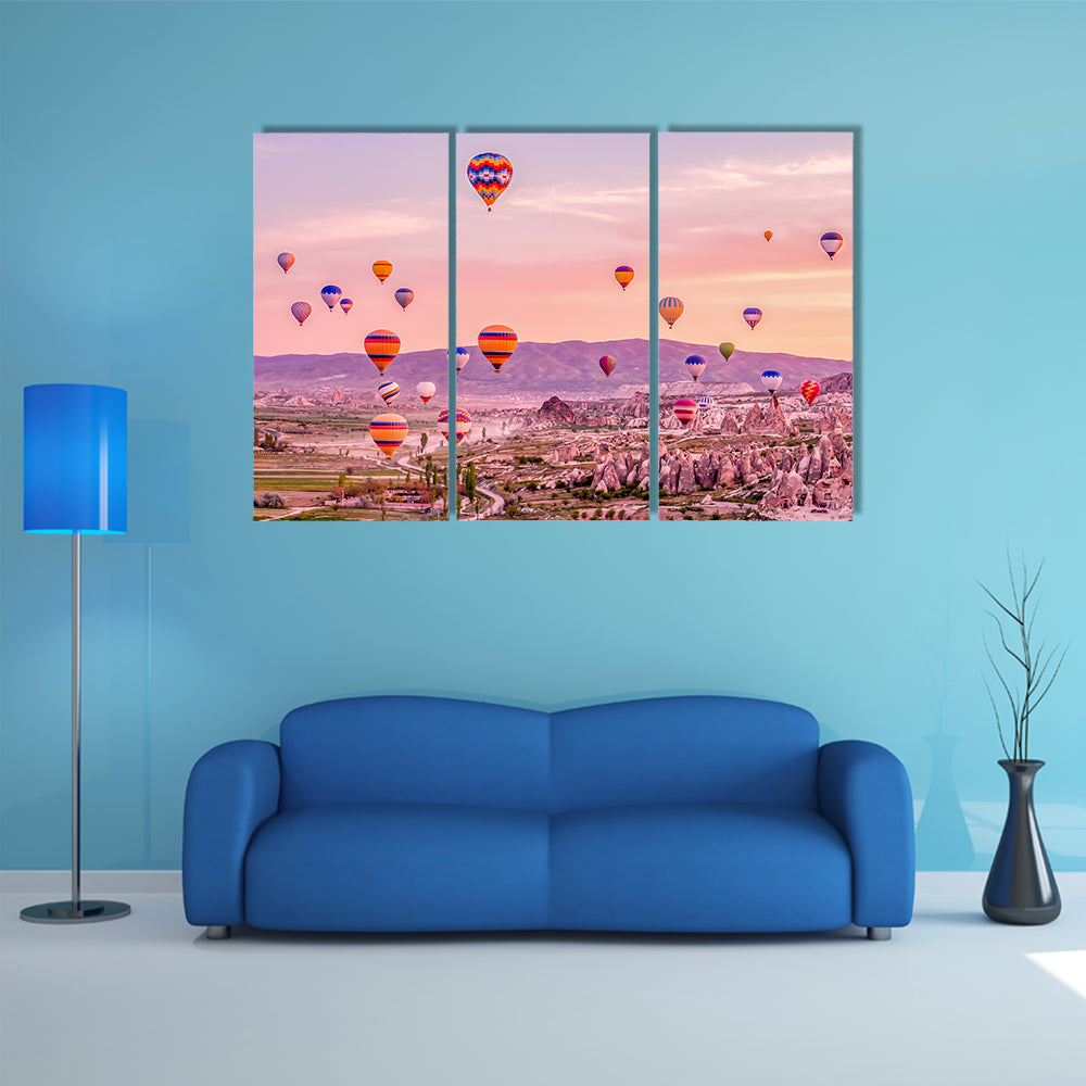 Hot Air balloons Flying Over Rock Landscape At Cappadocia Canvas Wall Art