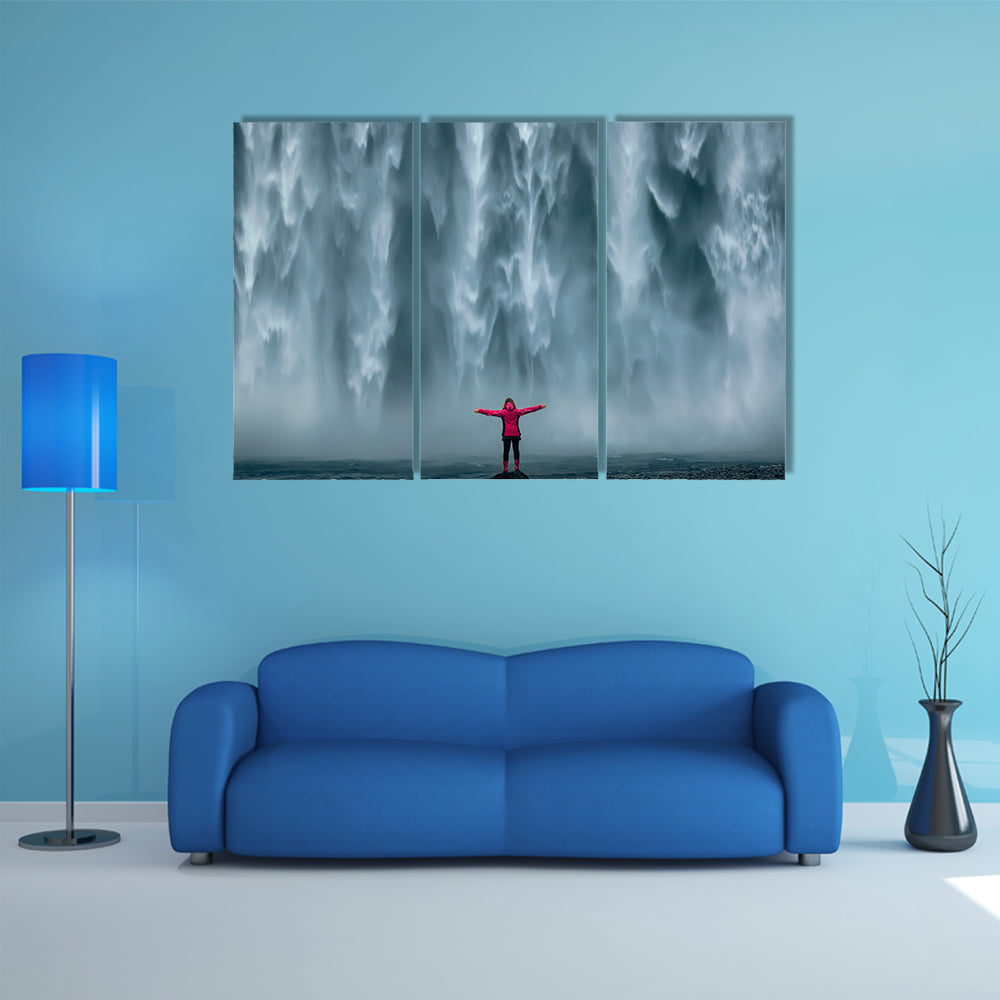 Girl Against Skogafoss Waterfall At South Iceland Canvas Wall Art