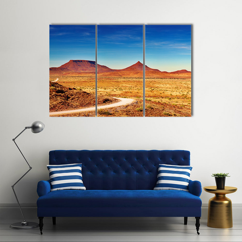 Winding Desert Road to Distant Peaks Canvas Wall Art