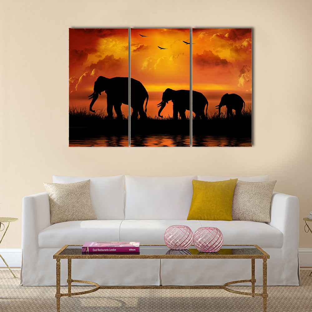 Three Elephants at Sunset Canvas Wall Art