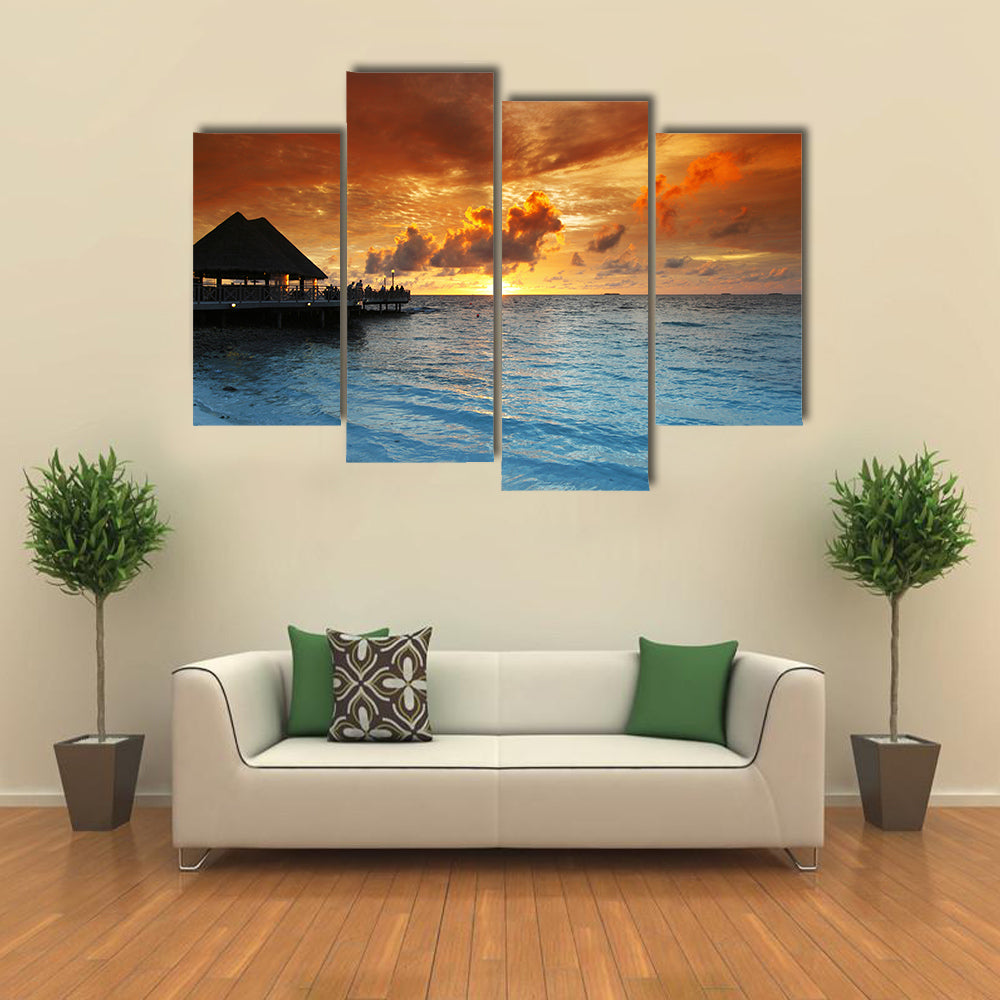 Maldives Thatched Hut on Pier at Sunset Canvas Wall Art