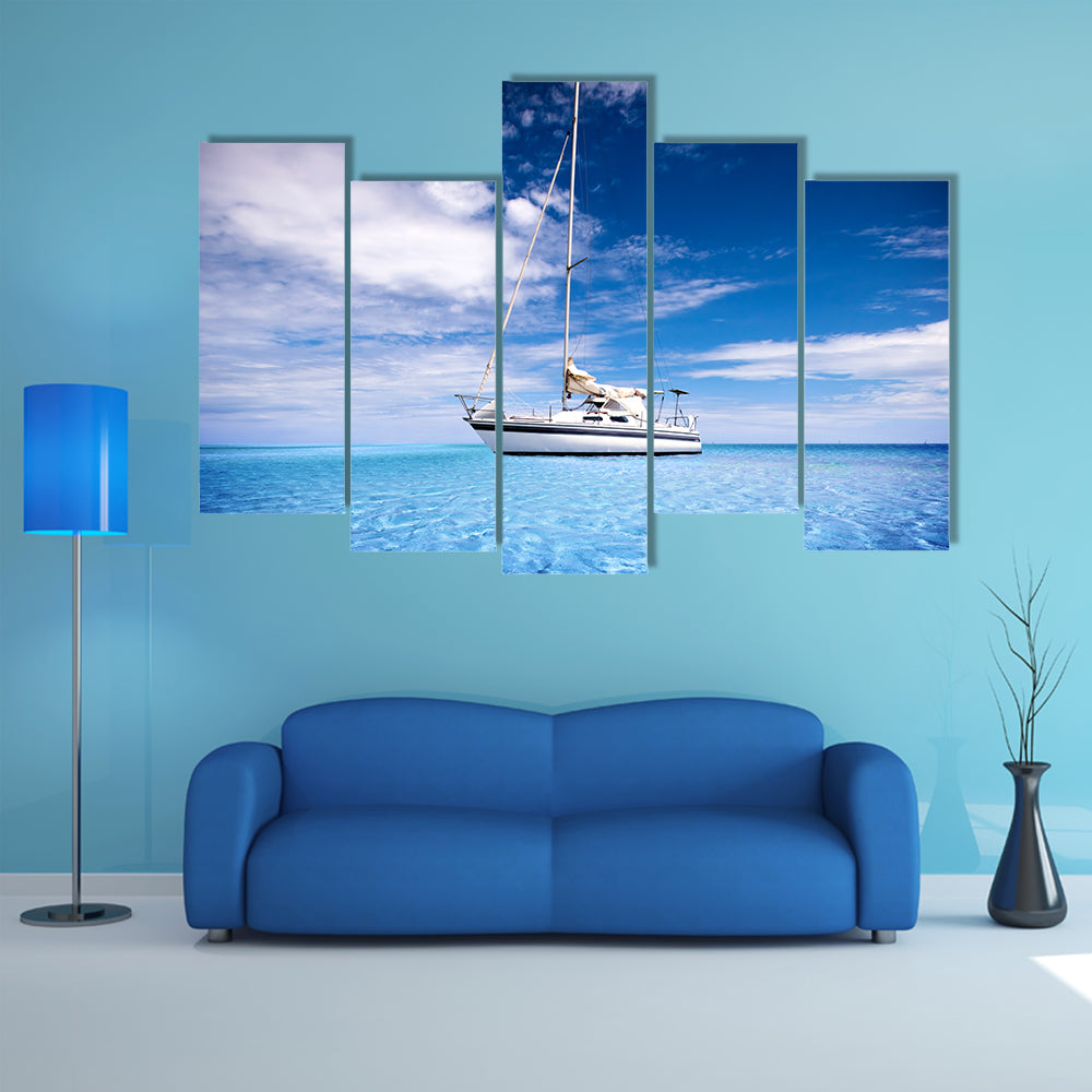 Single-masted White Sailboat on Turquoise Water Canvas Wall Art