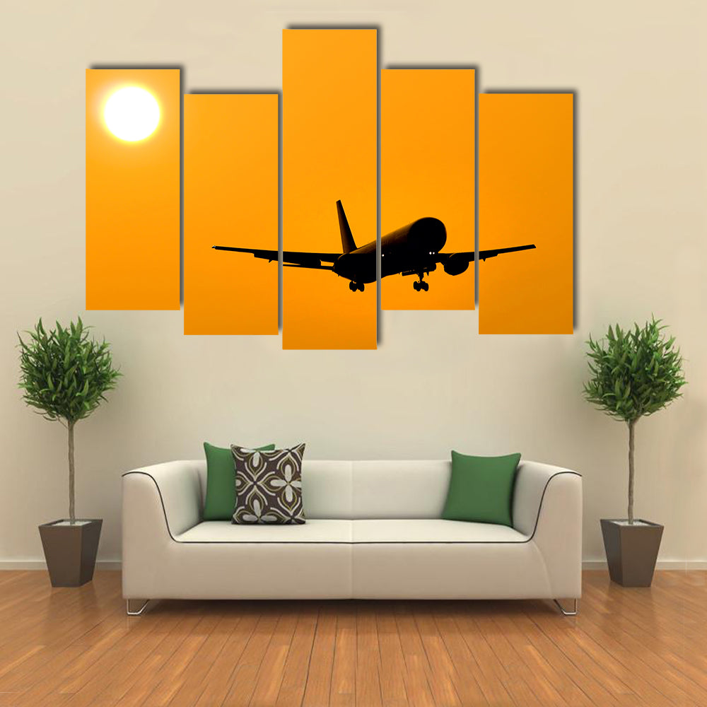 Aircraft Landing At Sunset Canvas Wall Art
