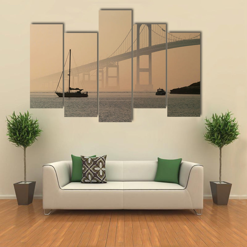 Hazy Suspension Bridge with Sailboat Canvas Wall Art