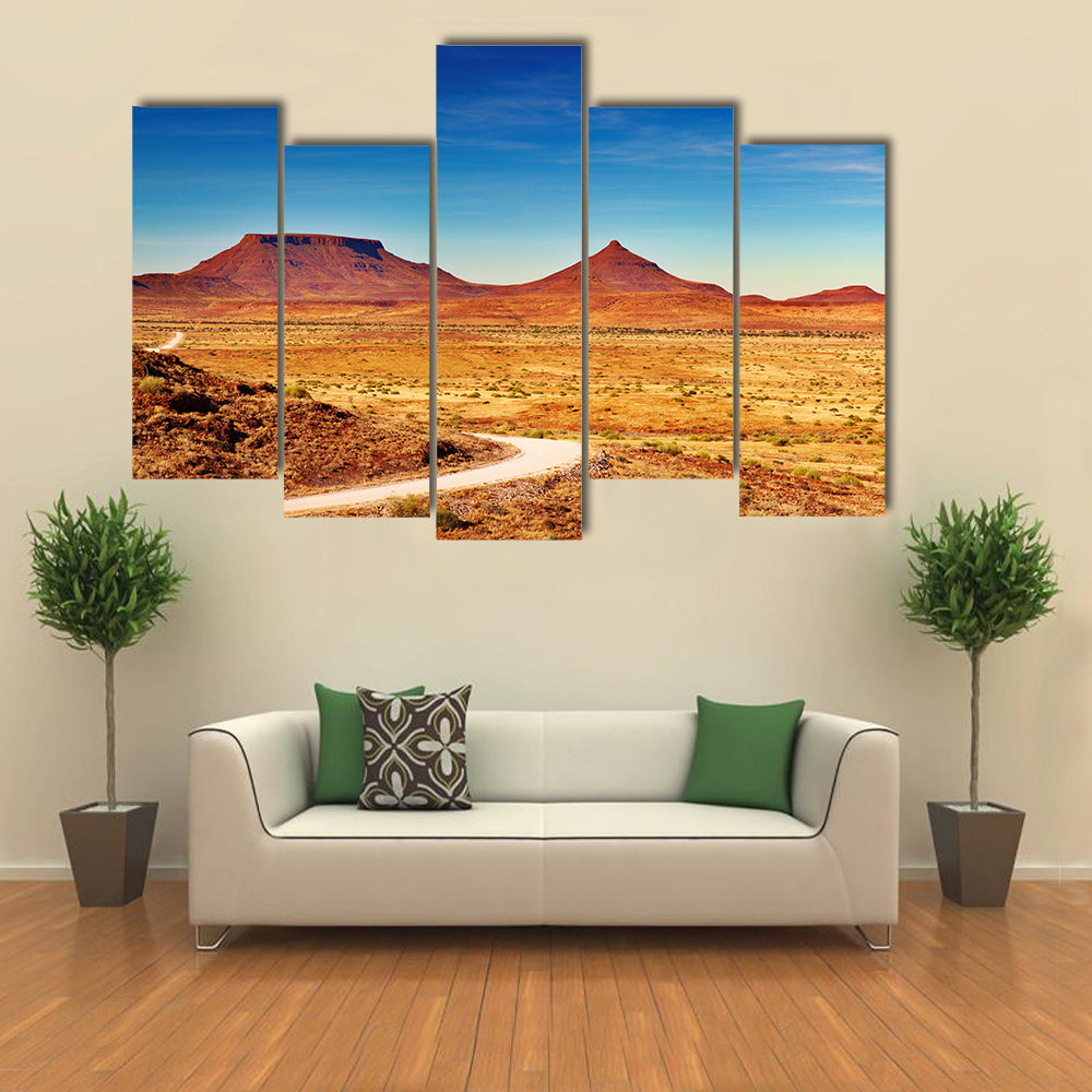 Winding Desert Road to Distant Peaks Canvas Wall Art