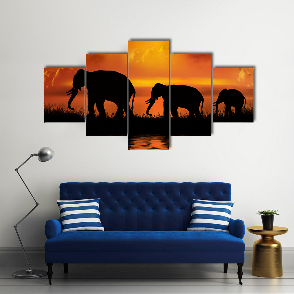 Three Elephants at Sunset Canvas Wall Art