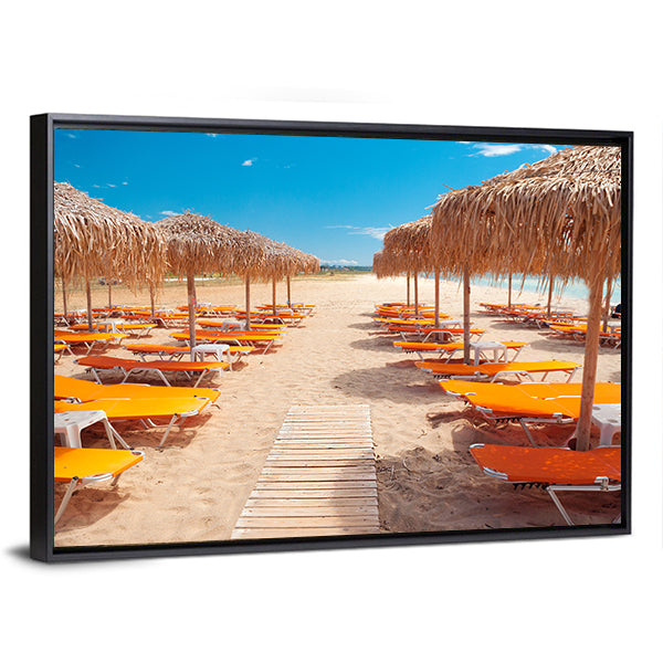 Greek Beach with Wooden Walkway and Orange Loungers Canvas Wall Art