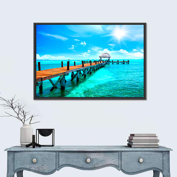 Sunlit Wooden Pier and Thatched Hut Canvas Wall Art
