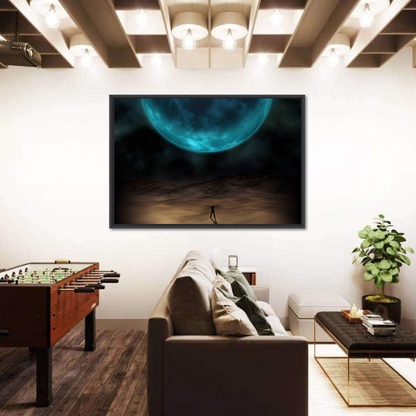 Silhouetted Figure Beneath Giant Blue Planet Canvas Wall Art