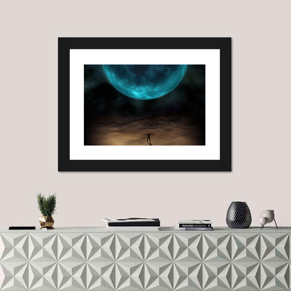 Silhouetted Figure Beneath Giant Blue Planet Canvas Wall Art