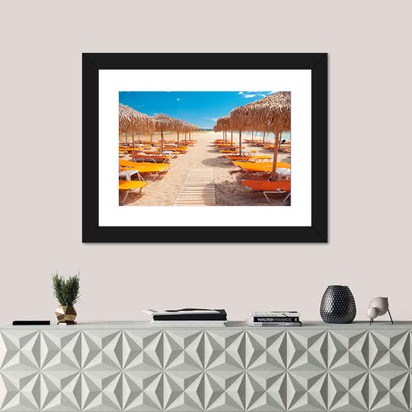 Greek Beach with Wooden Walkway and Orange Loungers Canvas Wall Art