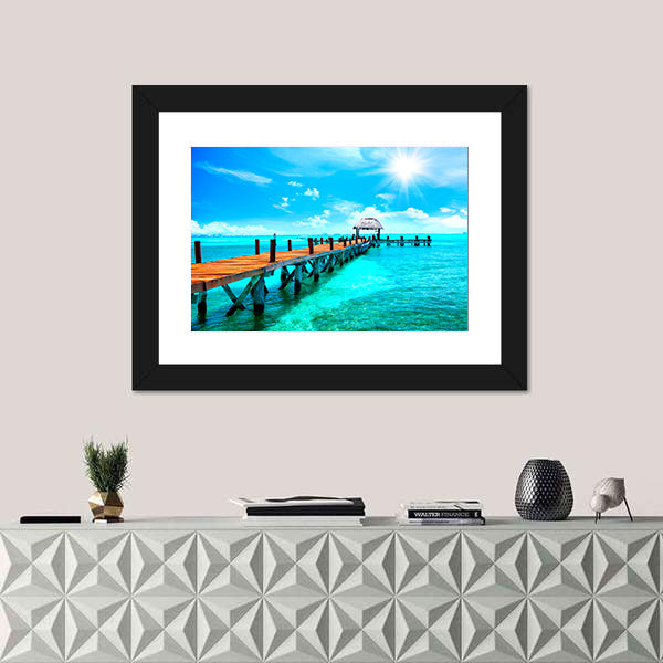 Sunlit Wooden Pier and Thatched Hut Canvas Wall Art