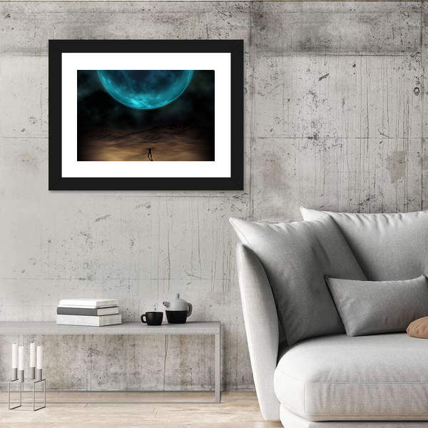 Silhouetted Figure Beneath Giant Blue Planet Canvas Wall Art