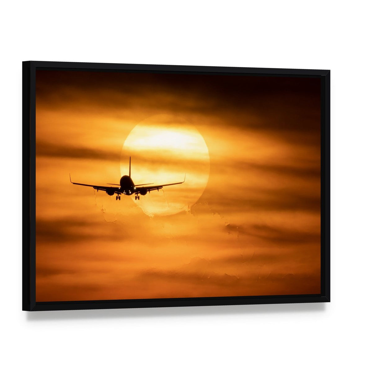 Airplane Silhouette at Sunset Canvas Wall Art, framed canvas in a black floater frame, angled product view