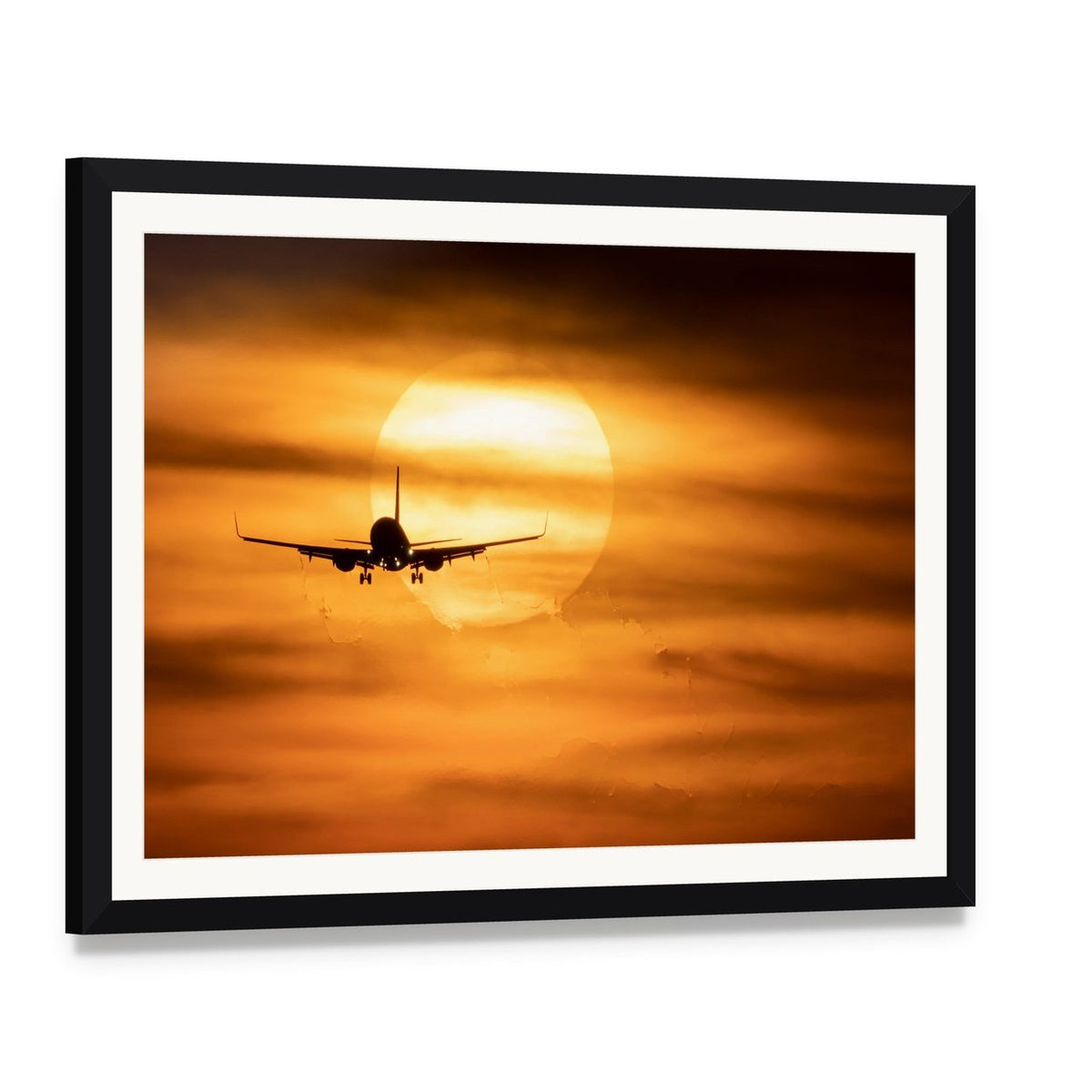 Airplane Silhouette at Sunset Canvas Wall Art, framed print with white mat and black frame, angled product view