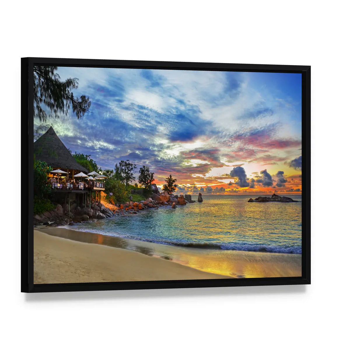 Sunset Cafe on Tropical Beach Canvas Wall Art, framed canvas in a black floater frame, angled product view