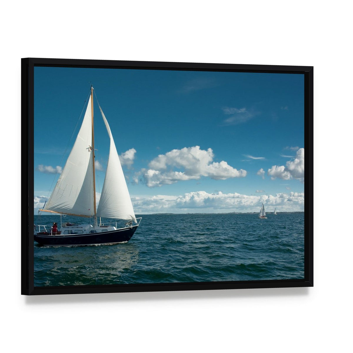 Sailing Boat on the Sea Canvas Wall Art, framed canvas in a black floater frame, angled product view