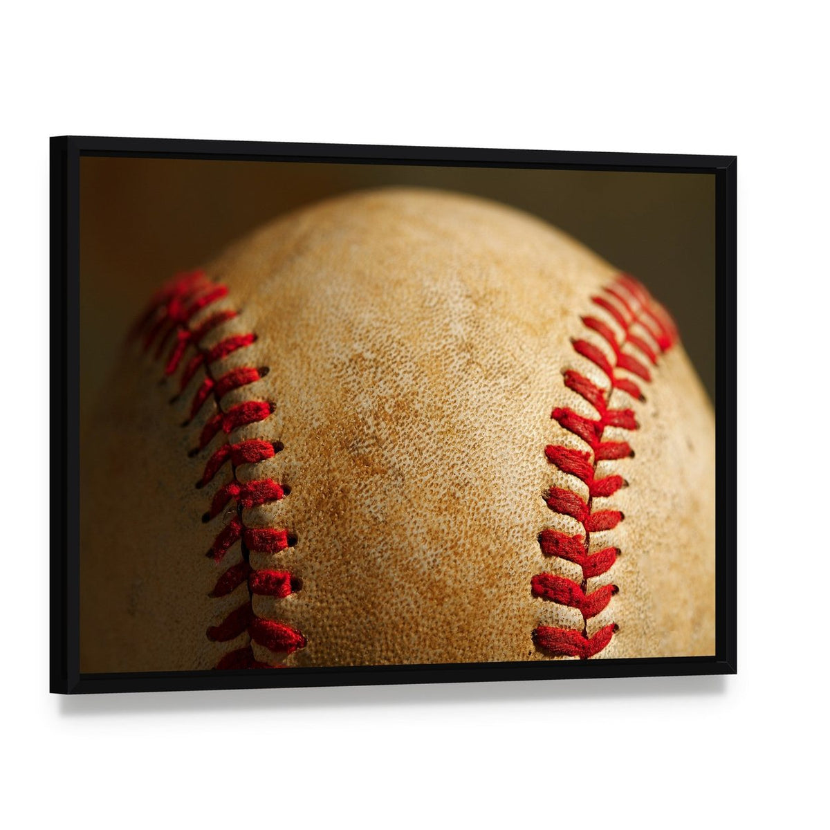 Close Up of Baseball Canvas Wall Art, framed canvas in a black floater frame, angled product view