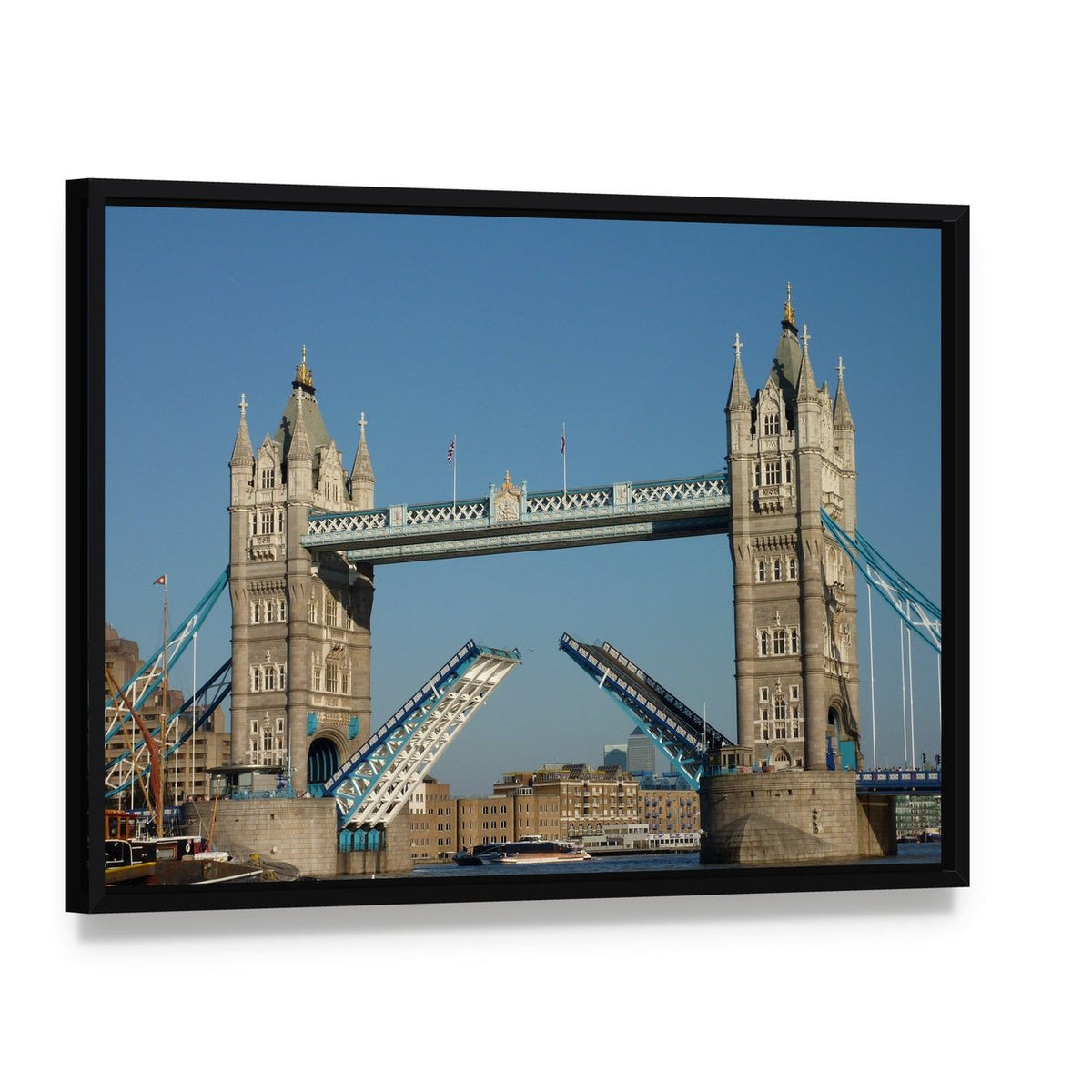 Tower Bridge Over the River Thames Canvas Wall Art, framed canvas in a black floater frame, angled product view