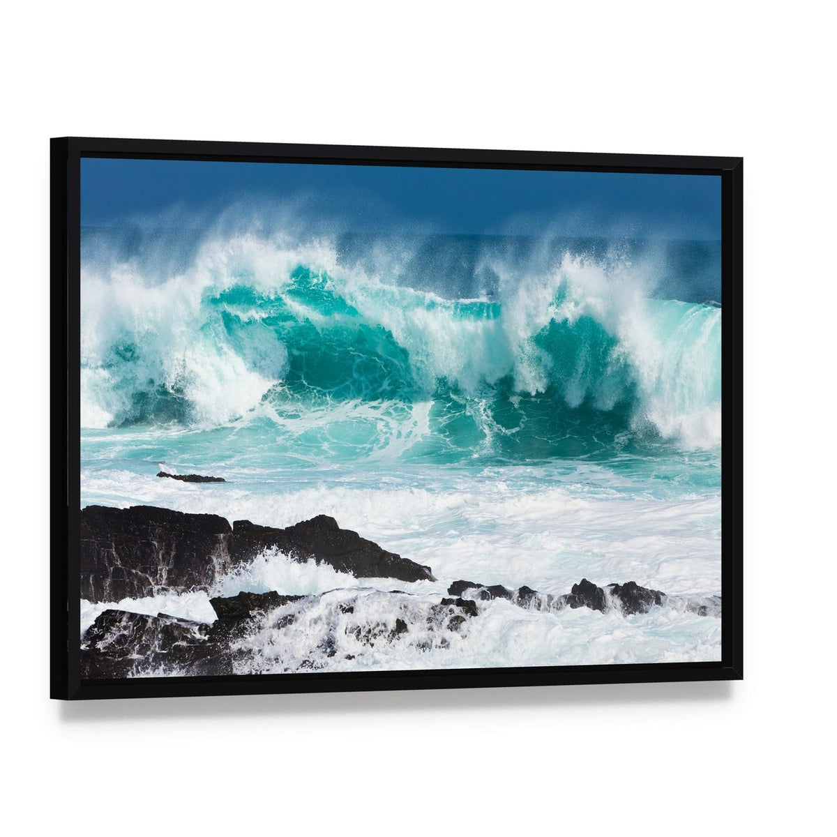 Turquoise Rolling Wave Crashing on Rocks Canvas Wall Art, framed canvas in a black floater frame, angled product view