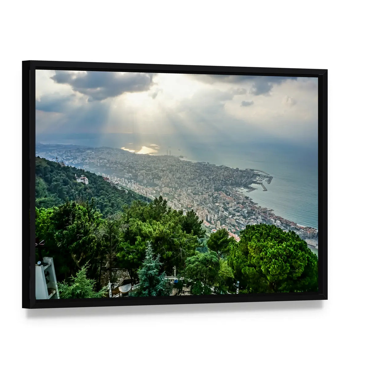 Sunbeams Over Coastal Cityscape Canvas Wall Art, framed canvas in a black floater frame, angled product view