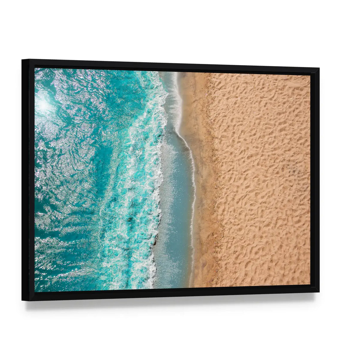 Coastline Beach Ocean Waves With Foam On The Sand Canvas Wall Art, framed canvas in a black floater frame, angled product view
