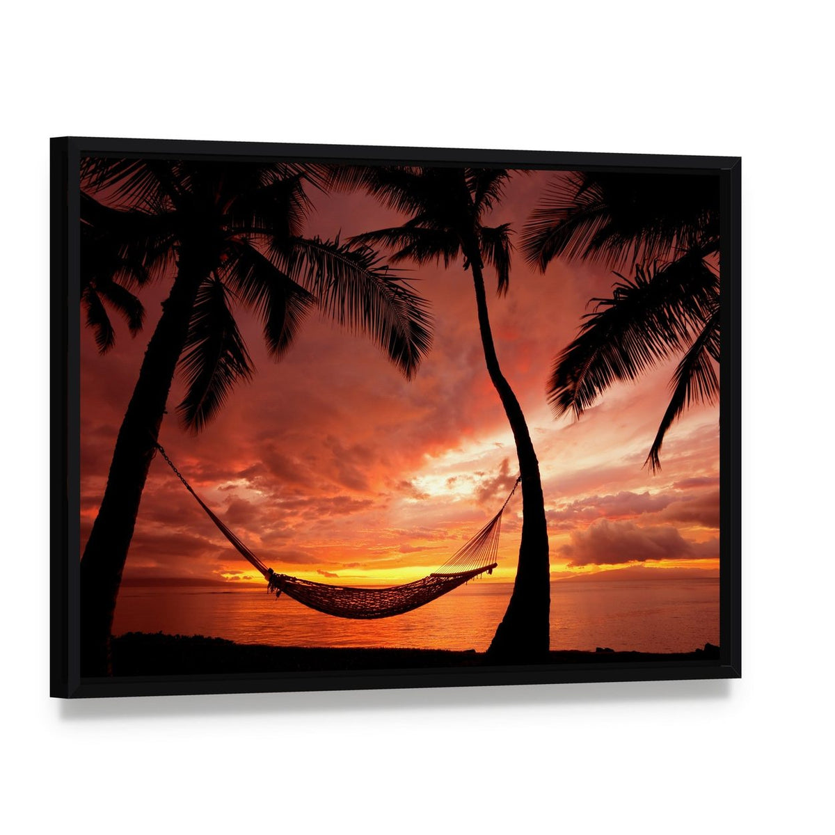 Serene Sunset with Silhouetted Palm Trees Canvas Wall Art, framed canvas in a black floater frame, angled product view