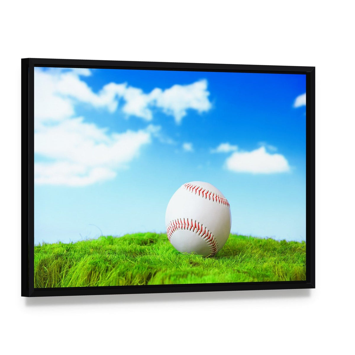 Baseball in Green Grass Canvas Wall Art, framed canvas in a black floater frame, angled product view