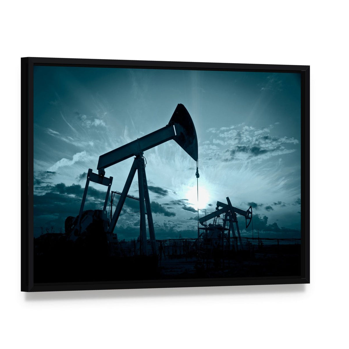 Silhouetted Oil Pumps at Sunset Canvas Wall Art, framed canvas in a black floater frame, angled product view