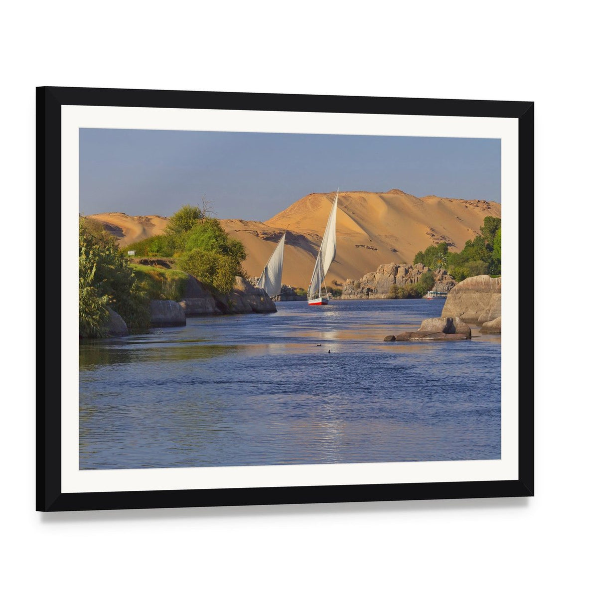 Sailing on the Serene Nile River Canvas Wall Art, framed print with white mat and black frame, angled product view