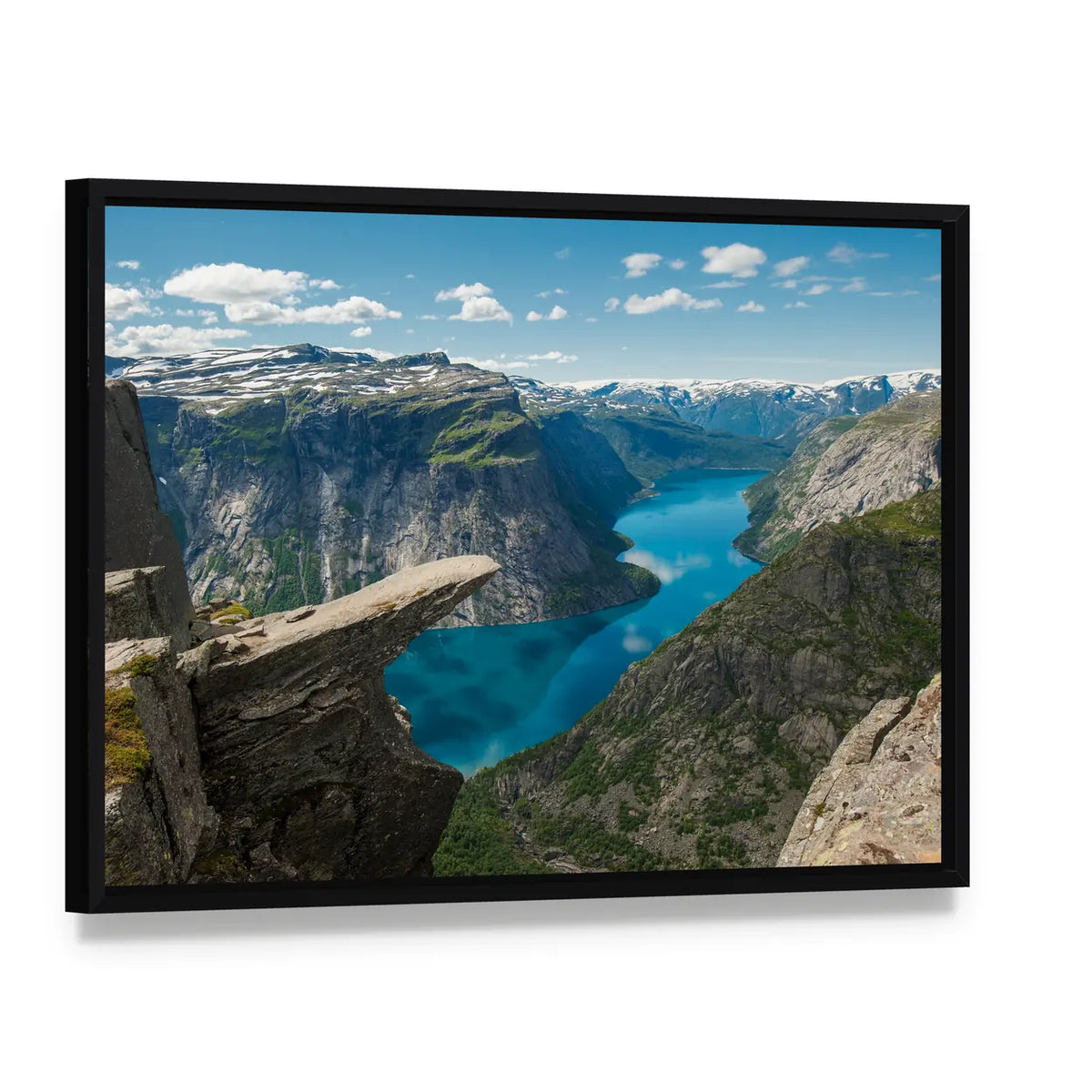 Trolltunga Rock Formation Canvas Wall Art, framed canvas in a black floater frame, angled product view