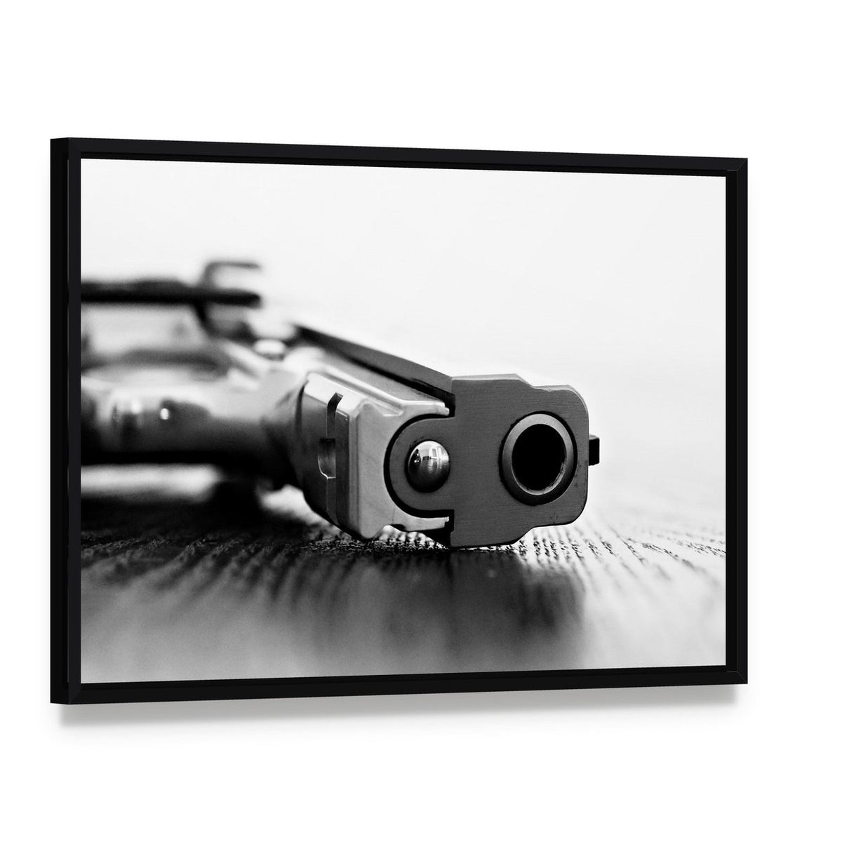 9mm Gun Canvas Wall Art, framed canvas in a black floater frame, angled product view