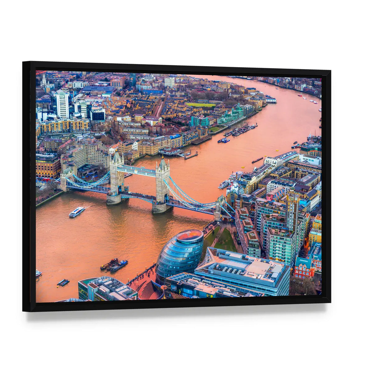 Tower Bridge And Thames River In London Canvas Wall Art, framed canvas in a black floater frame, angled product view