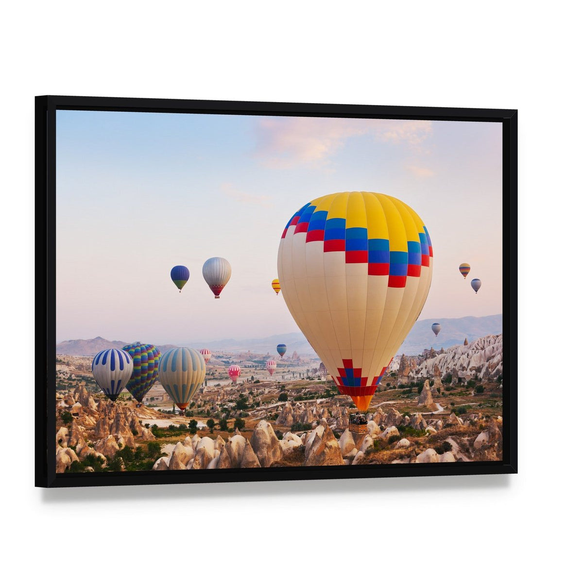 Hot Air Balloons Over Cappadocia Canvas Wall Art, framed canvas in a black floater frame, angled product view