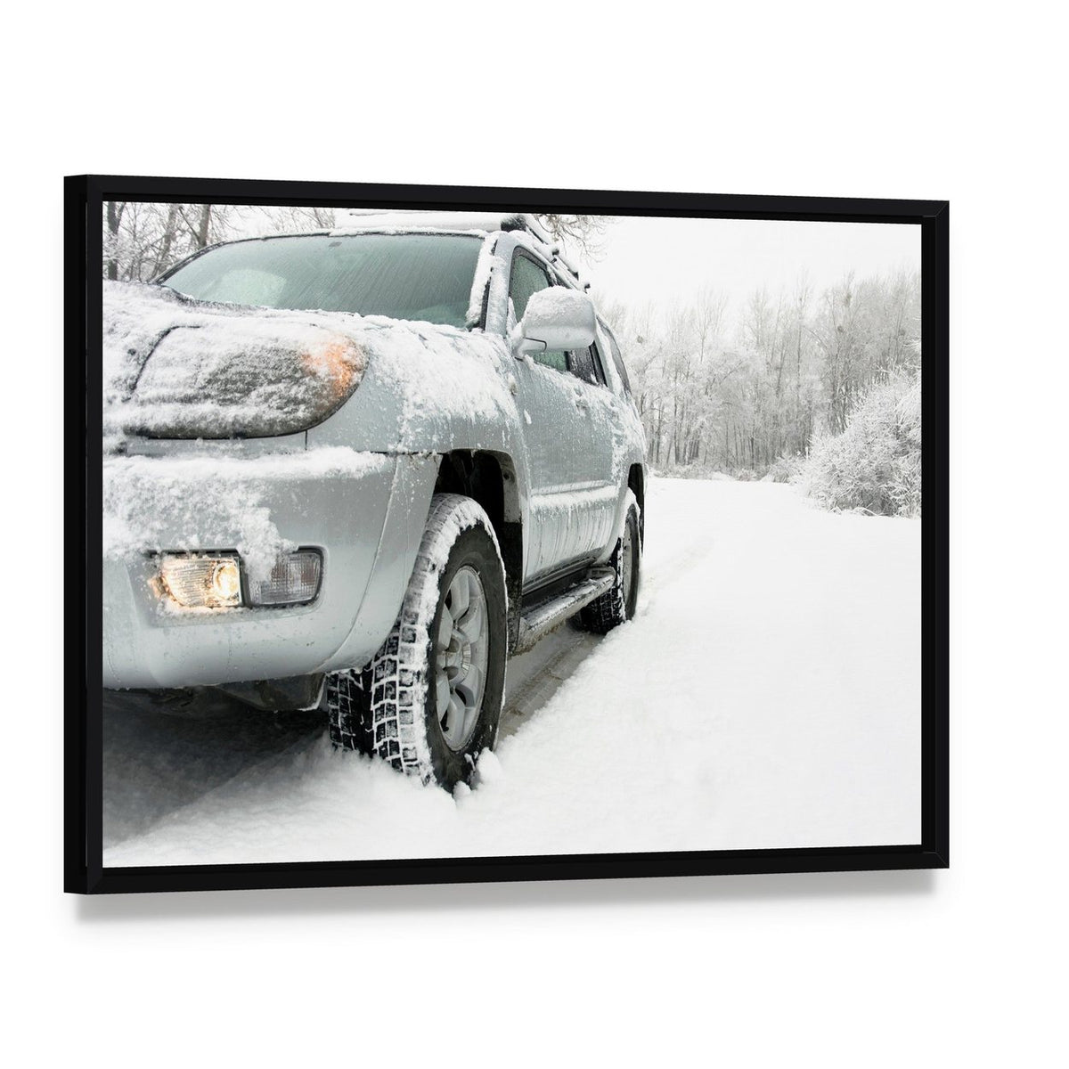 Snowy Winter Car and Road Canvas Wall Art, framed canvas in a black floater frame, angled product view