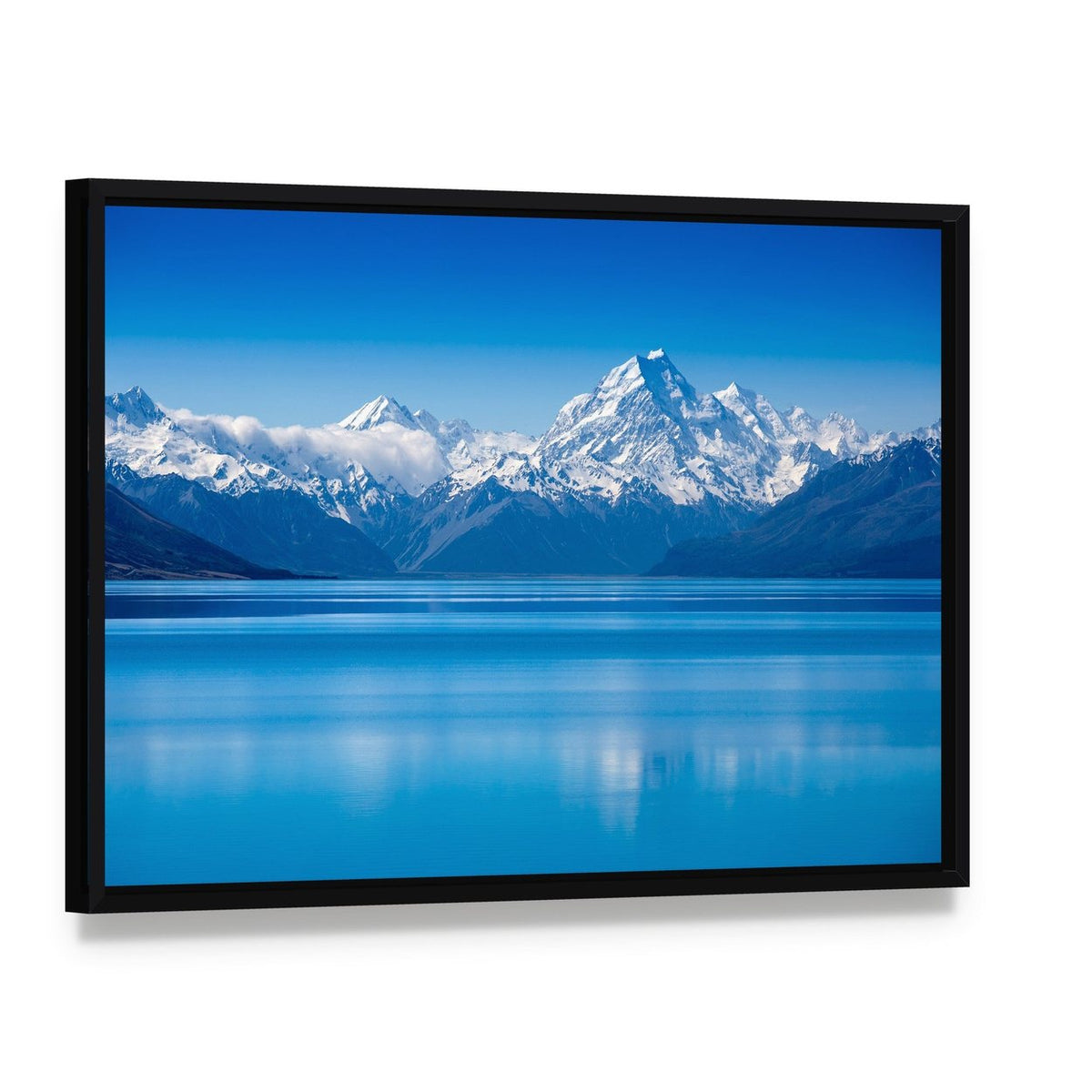 Lake Pukaki Canvas Wall Art, framed canvas in a black floater frame, angled product view