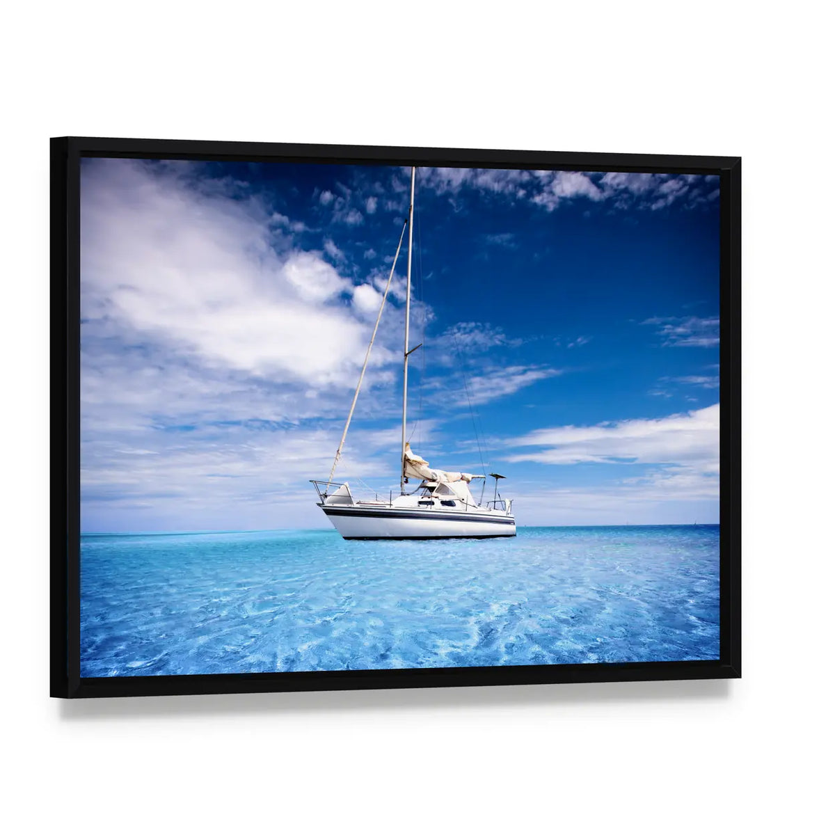 Single-masted White Sailboat on Turquoise Water Canvas Wall Art, framed canvas in a black floater frame, angled product view