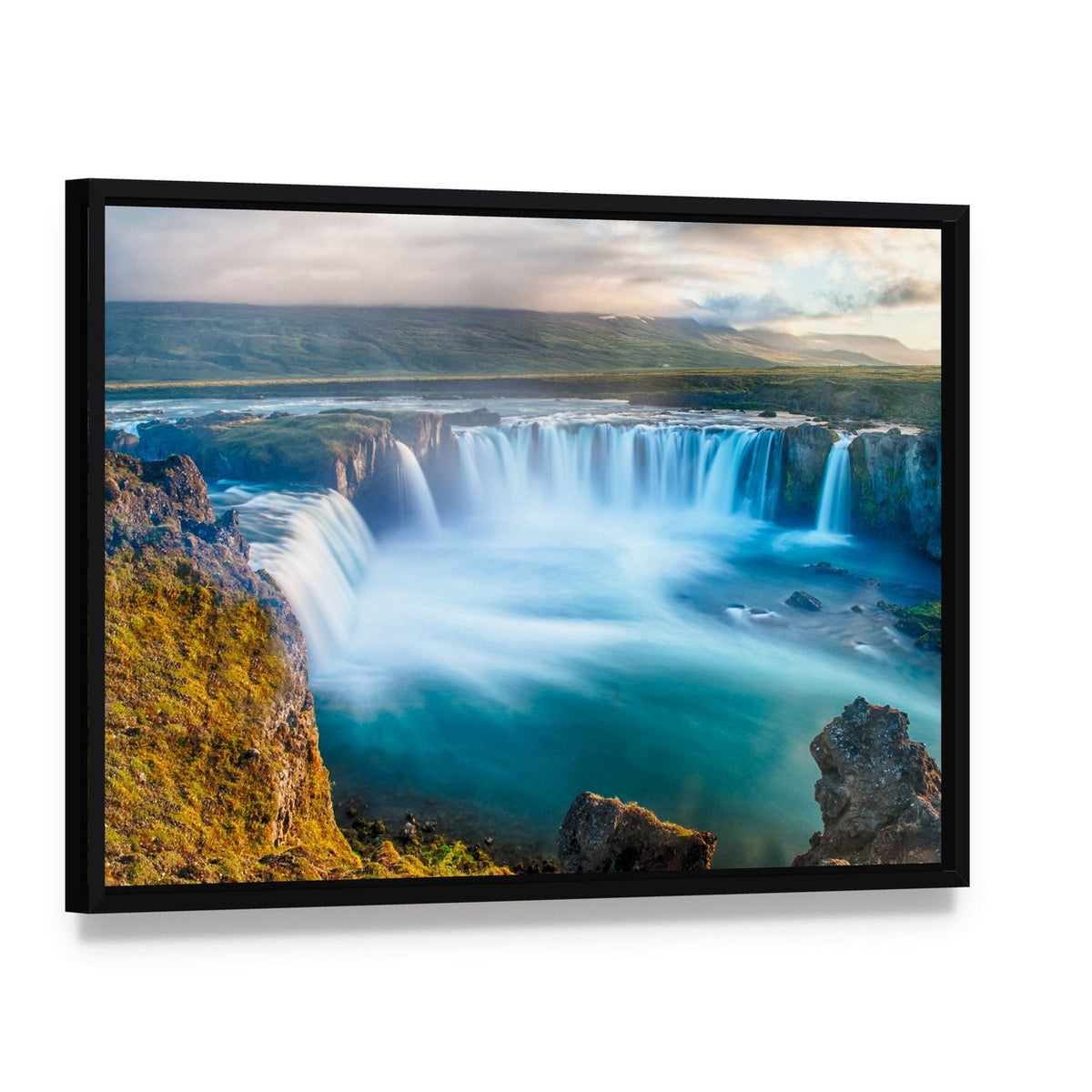 Godafoss Waterfall Iceland Canvas Wall Art, framed canvas in a black floater frame, angled product view