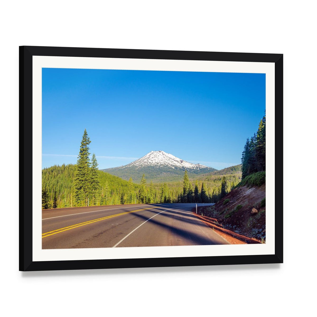 Mt Bachelor Road Through Forest Canvas Wall Art, framed print with white mat and black frame, angled product view