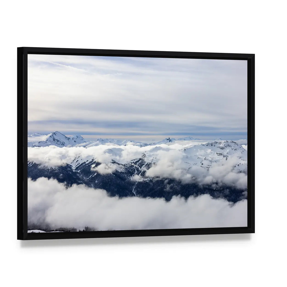 Canadian Mountains In Winter Canvas Wall Art, framed canvas in a black floater frame, angled product view