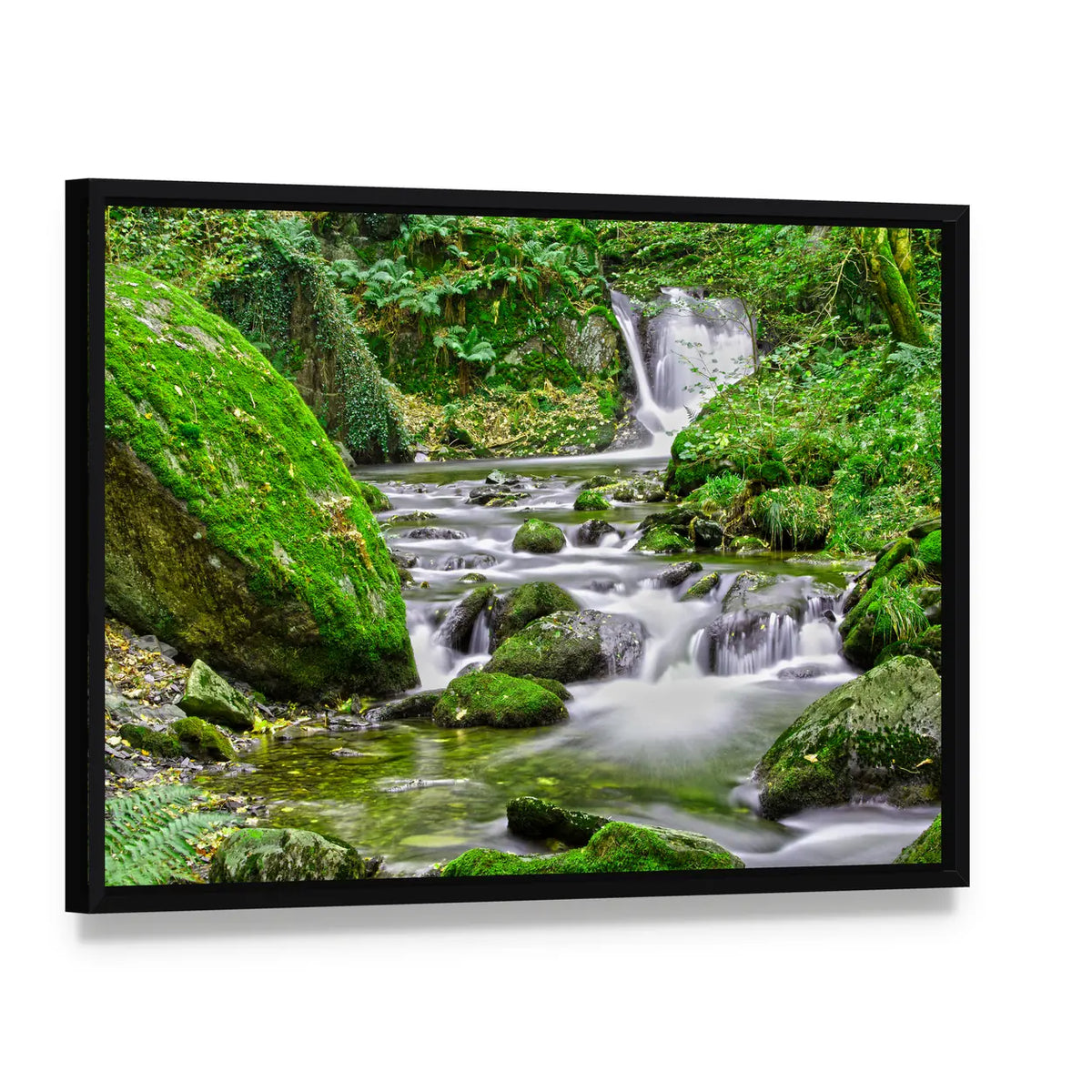 Tranquil Forest Stream And Waterfall Canvas Wall Art, framed canvas in a black floater frame, angled product view