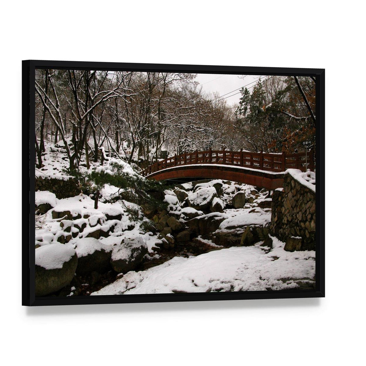 Korean Bridge in Winter Canvas Wall Art, framed canvas in a black floater frame, angled product view