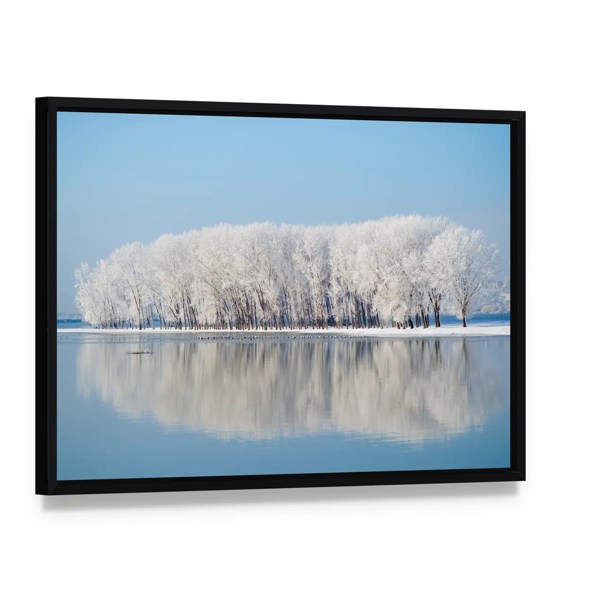 Clear Blue Winter Landscape Canvas Wall Art, framed canvas in a black floater frame, angled product view